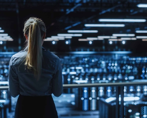 managed it servics woman standing in a server room