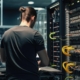 Back view of a man working in a server room
